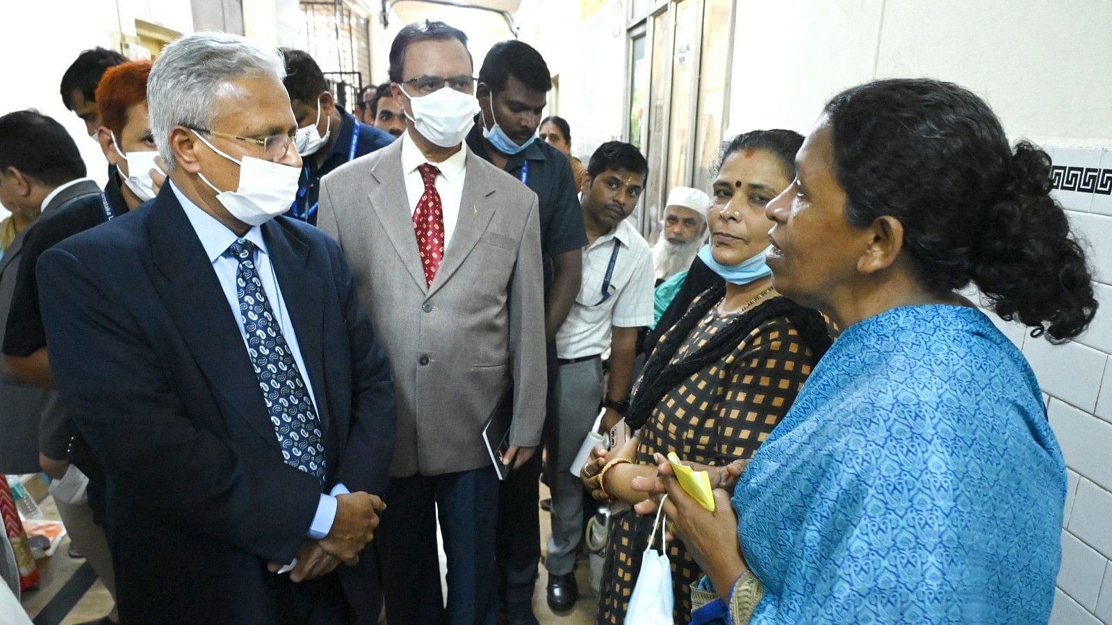 <div class="paragraphs"><p>Karnataka Lokayukta Justice B S Patil interacts with patients and their attendants at Victoria Hospital on Monday. </p></div>